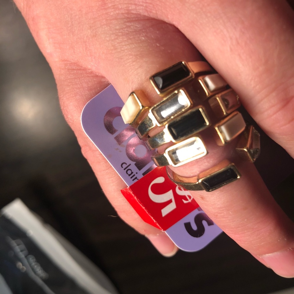 Clair’s geometric black and diamond gold rings